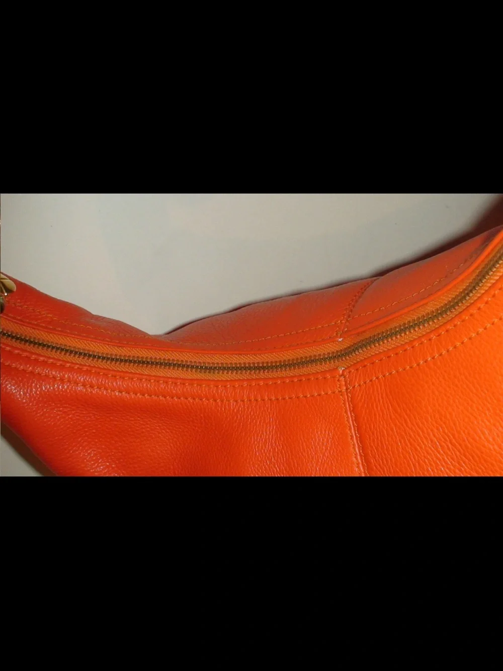 Mulberry Orange Leather Hobo Bag with Tassels and Gold Emblem